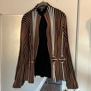 Size 2 Top travelers by Chico’s. Leather strips & fabric